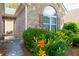Close up of Front door with well maintained flowerbeds at 5251 Centennial Hill Nw Dr, Acworth, GA 30102