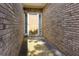 Side view of a welcoming front door in a brick facade at 5251 Centennial Hill Nw Dr, Acworth, GA 30102