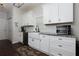 Kitchen featuring white cabinets, stainless appliances and farmhouse sink at 5251 Centennial Hill Nw Dr, Acworth, GA 30102