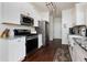 Modern kitchen with white cabinets, granite countertops, and stainless steel appliances at 5251 Centennial Hill Nw Dr, Acworth, GA 30102