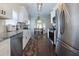 Modern kitchen with stainless steel appliances, granite countertops and hardwood floors at 5251 Centennial Hill Nw Dr, Acworth, GA 30102