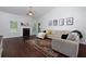Spacious living room with vaulted ceiling, fireplace, and dark wood floors at 5251 Centennial Hill Nw Dr, Acworth, GA 30102