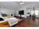 Open-concept living room with hardwood floors and modern furnishings at 5251 Centennial Hill Nw Dr, Acworth, GA 30102
