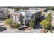 Aerial view of a mixed-use building with dining options, retail, and apartments with balconies at 58 Canton St # 410, Alpharetta, GA 30009