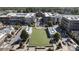 Aerial view of buildings surrounded by streetscapes, green spaces, and a central green at 58 Canton St # 410, Alpharetta, GA 30009
