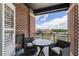 Relaxing balcony featuring seating, a fireplace, and a view of the surrounding neighborhood at 58 Canton St # 410, Alpharetta, GA 30009