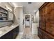Bathroom featuring double sinks, wooden cabinet, large closet and walk in shower at 58 Canton St # 410, Alpharetta, GA 30009