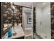 Stylish bathroom with patterned wallpaper, modern fixtures, and walk-in shower at 58 Canton St # 410, Alpharetta, GA 30009