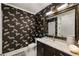 Chic bathroom with patterned wallpaper, marble countertop, and modern fixtures at 58 Canton St # 410, Alpharetta, GA 30009