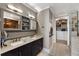 Bathroom featuring double sink vanity with marble counters, and a walk in closet at 58 Canton St # 410, Alpharetta, GA 30009