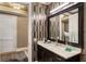 Modern bathroom featuring sleek vanity, elegant mirror, designer wallpaper, and marble countertop at 58 Canton St # 410, Alpharetta, GA 30009