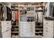 Organized closet with white shelving, drawers, and ample storage space for clothes and shoes at 58 Canton St # 410, Alpharetta, GA 30009