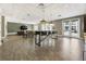Spacious clubhouse featuring a large table, pendant lighting, a TV, and an exterior door at 58 Canton St # 410, Alpharetta, GA 30009