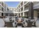 Relaxing courtyard with a fire pit, comfortable seating, and views of upper-level balconies at 58 Canton St # 410, Alpharetta, GA 30009