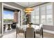 Dining area with a balcony, contemporary light fixture, and window shutters at 58 Canton St # 410, Alpharetta, GA 30009
