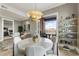 Dining area with a round table, modern chandelier, and access to outdoor balcony at 58 Canton St # 410, Alpharetta, GA 30009
