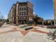 Well-maintained mixed-use building featuring a fountain, retail space, and residential apartments at 58 Canton St # 410, Alpharetta, GA 30009