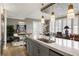 Spacious kitchen featuring island with marble countertops, sink, and stainless steel refrigerator at 58 Canton St # 410, Alpharetta, GA 30009