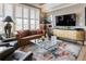 Comfortable living room with natural light, stylish furniture, and wood floors at 58 Canton St # 410, Alpharetta, GA 30009