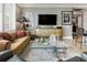 Inviting living room with a modern media center and neutral color palette at 58 Canton St # 410, Alpharetta, GA 30009