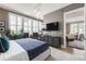 Well-lit main bedroom with shutters, modern furniture, and a view to the dining room at 58 Canton St # 410, Alpharetta, GA 30009