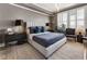 Elegant main bedroom featuring tray ceilings, an upholstered bed, and neutral color palette at 58 Canton St # 410, Alpharetta, GA 30009
