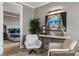 Sitting room with an artistic portrait and view of the Primary bedroom at 58 Canton St # 410, Alpharetta, GA 30009
