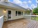 Large back deck with access to the house and view of backyard landscaping at 2910 Waverly Place Dr, Dacula, GA 30019