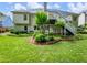 Backyard view with a deck, beautiful landscaping and lush green grass, providing a serene outdoor retreat at 2910 Waverly Place Dr, Dacula, GA 30019