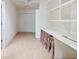 Finished basement area featuring a desk area with built-in shelves at 2910 Waverly Place Dr, Dacula, GA 30019