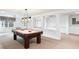 Finished basement area featuring a pool table, window, and built-in shelves at 2910 Waverly Place Dr, Dacula, GA 30019