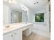 Bright bathroom with dual sinks, a large mirror, white cabinets, and a garden tub at 2910 Waverly Place Dr, Dacula, GA 30019