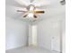 Bedroom featuring a ceiling fan, two doors, and carpet at 2910 Waverly Place Dr, Dacula, GA 30019