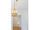 Crystal chandelier illuminating a bright room with doorways to other areas at 2910 Waverly Place Dr, Dacula, GA 30019