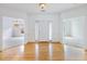Welcoming foyer with hardwood floors and views into adjacent rooms at 2910 Waverly Place Dr, Dacula, GA 30019