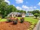Lovely brick home with a well-kept lawn and colorful flower beds enhancing curb appeal at 2910 Waverly Place Dr, Dacula, GA 30019
