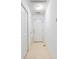 Hallway with doors and tile floor at 2910 Waverly Place Dr, Dacula, GA 30019