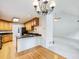 Open-concept kitchen featuring a breakfast bar and modern appliances at 2910 Waverly Place Dr, Dacula, GA 30019