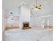 Large, bright room featuring a vaulted ceiling, fireplace, and hardwood floors at 2910 Waverly Place Dr, Dacula, GA 30019