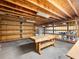 Unfinished basement area with workbench and shelving at 2910 Waverly Place Dr, Dacula, GA 30019