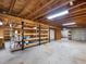 Unfinished basement space with exposed beams, shelving, and cement walls at 2910 Waverly Place Dr, Dacula, GA 30019