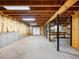 Unfinished basement with exposed beams and cement walls at 2910 Waverly Place Dr, Dacula, GA 30019