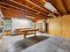 Unfinished basement featuring a workbench, shelving, and pegboard at 2910 Waverly Place Dr, Dacula, GA 30019