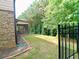 Fenced backyard with lawn, landscaping, and a screened-in porch at 3943 Ridge Grove Way, Suwanee, GA 30024