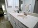 Bright bathroom featuring a double sink vanity with white cabinets and neutral countertops at 3943 Ridge Grove Way, Suwanee, GA 30024