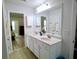 Bathroom featuring double sinks and a large mirror offering functionality and space at 3943 Ridge Grove Way, Suwanee, GA 30024