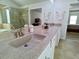 Bathroom showing double sinks and granite countertops, across from a clear glass shower at 3943 Ridge Grove Way, Suwanee, GA 30024