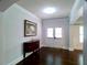 Beautiful entryway featuring dark wood floors and a decorative cabinet below an art piece at 3943 Ridge Grove Way, Suwanee, GA 30024