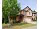 Attractive home with brick and siding exterior, well-kept lawn, and mature trees at 3943 Ridge Grove Way, Suwanee, GA 30024