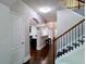 Inviting foyer features hardwood floors, arched doorways, and a staircase with iron spindles at 3943 Ridge Grove Way, Suwanee, GA 30024